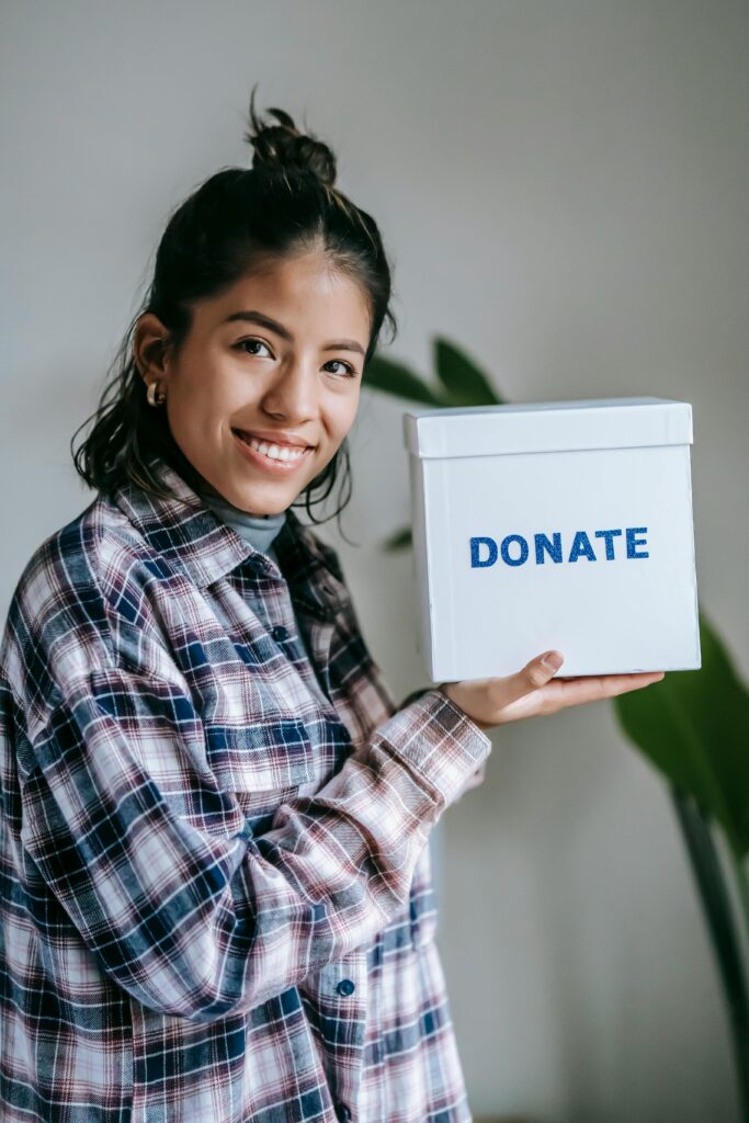 Woman holding a donation box 